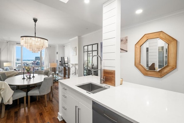 500 Atlantic Ave Unit 15M, Boston, MA 02110 - kitchen featuring open floor plan, light countertops, a chandelier, dark wood-style floors, and crown molding