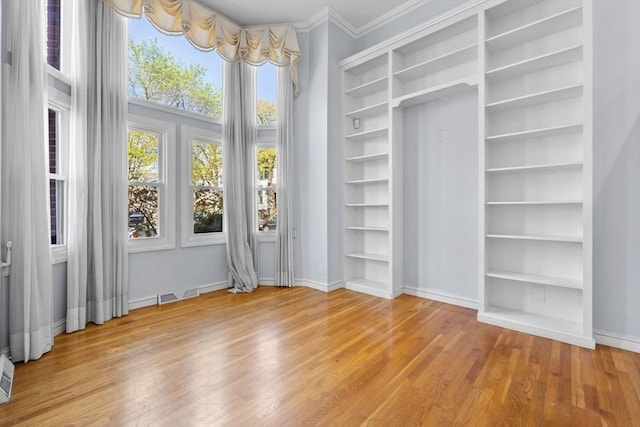 spacious closet featuring light wood-style floors and visible vents