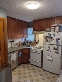 35-1 Neponset, Revere, MA 02151 - kitchen featuring white appliances, under cabinet range hood, brown cabinets, and a sink