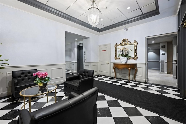 living room with ornamental molding and a notable chandelier