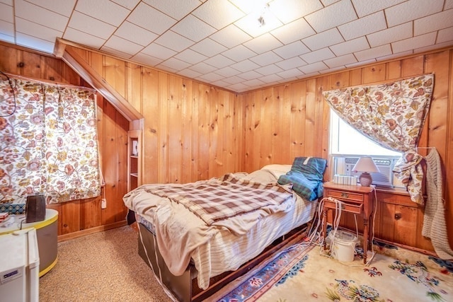 bedroom with wooden walls