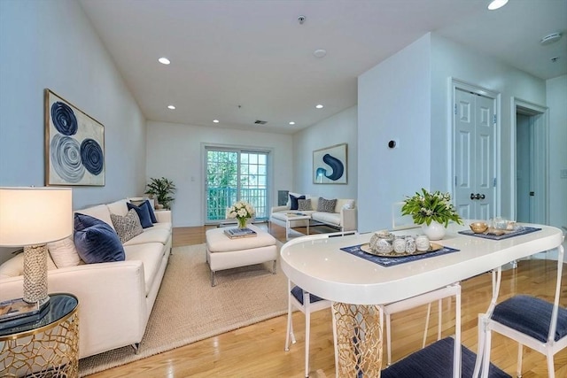 living area featuring light wood-style floors and recessed lighting