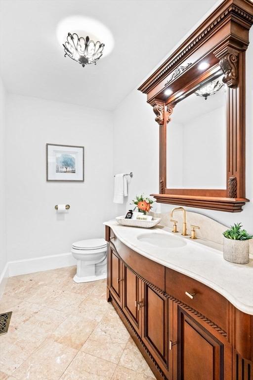 9 Wescott Rd, Andover, MA 01810 - bathroom with vanity, toilet, baseboards, and tile patterned floors