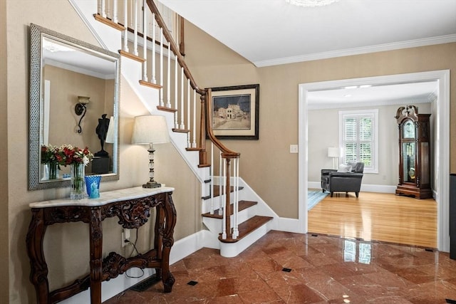 9 Wescott Rd, Andover, MA 01810 - entrance foyer featuring ornamental molding, stairway, and baseboards