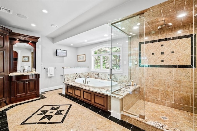 9 Wescott Rd, Andover, MA 01810 - full bath featuring inlaid floor details, a shower stall, baseboards, a garden tub, and recessed lighting