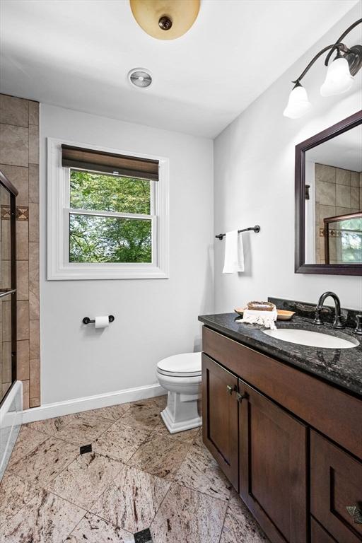 9 Wescott Rd, Andover, MA 01810 - full bath with vanity, toilet, baseboards, and enclosed tub / shower combo