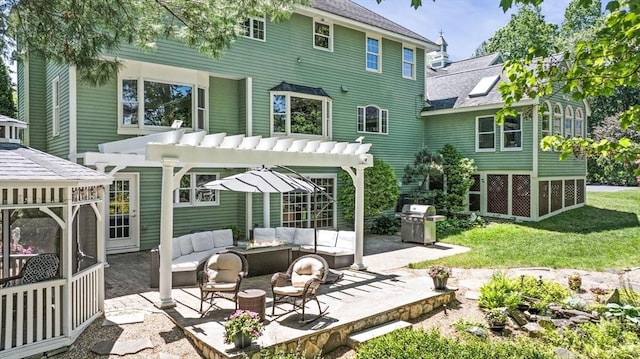 9 Wescott Rd, Andover, MA 01810 - back of property with an outdoor hangout area, a patio, roof with shingles, a pergola, and a lawn