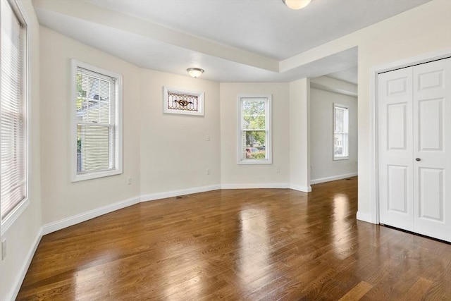 111-113 Pleasant St, Milton, MA 02186 - empty room with wood finished floors and baseboards