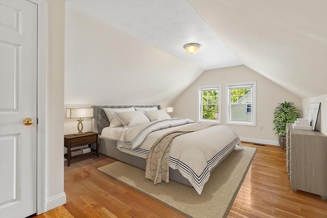 111-113 Pleasant St, Milton, MA 02186 - bedroom featuring light wood-style floors and vaulted ceiling