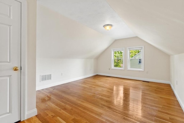 111-113 Pleasant St, Milton, MA 02186 - bonus room with light wood-style floors and vaulted ceiling