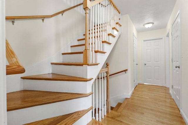 111-113 Pleasant St, Milton, MA 02186 - stairs featuring wood finished floors and baseboards