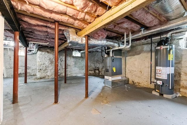 111-113 Pleasant St, Milton, MA 02186 - unfinished below grade area featuring water heater and heating unit