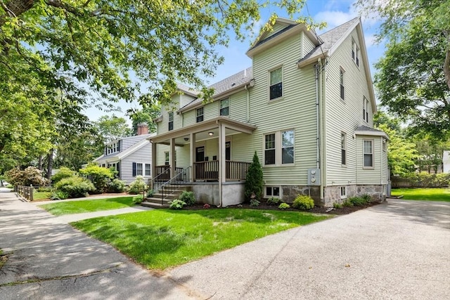 111-113 Pleasant St, Milton, MA 02186 - view of front of property with a porch and a front yard