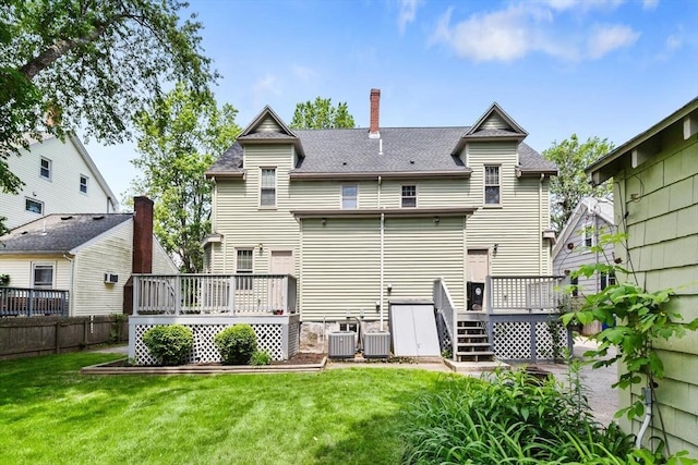 111-113 Pleasant St, Milton, MA 02186 - back of property with a wooden deck, a chimney, and roof with shingles