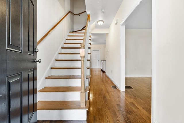 111-113 Pleasant St, Milton, MA 02186 - stairs with wood finished floors and baseboards