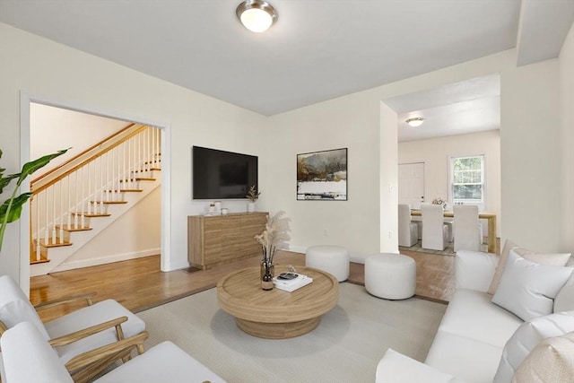 111-113 Pleasant St, Milton, MA 02186 - living room featuring wood finished floors and stairway