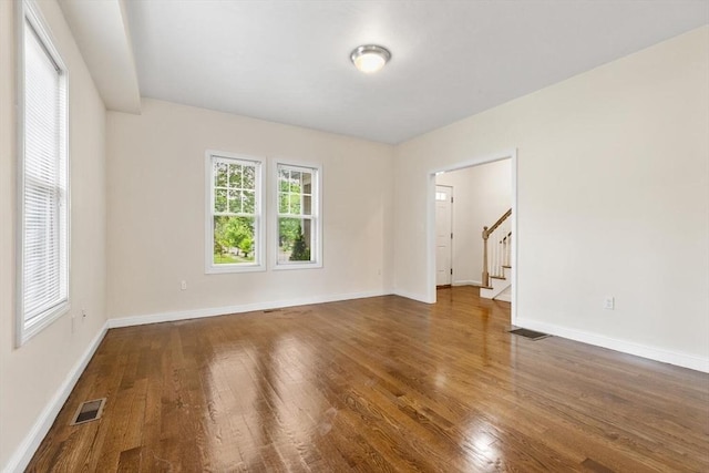 111-113 Pleasant St, Milton, MA 02186 - empty room with stairway and wood finished floors