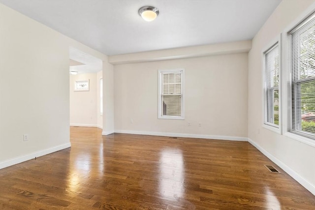 111-113 Pleasant St, Milton, MA 02186 - empty room with plenty of natural light and wood finished floors
