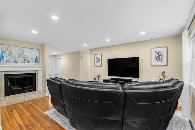 23 Cherokee Rd, Acton, MA 01720 - living room with wood finished floors, recessed lighting, and a tile fireplace