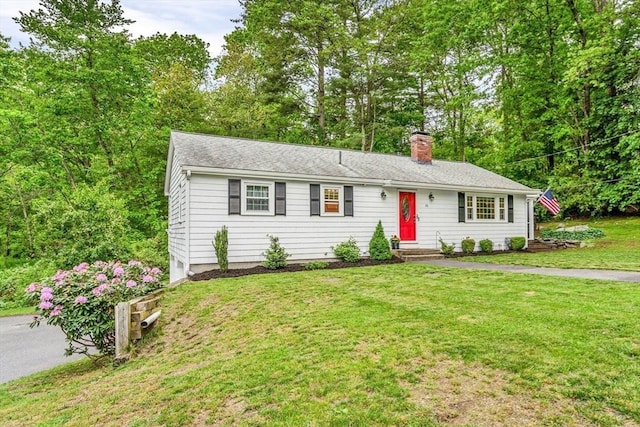 23 Cherokee Rd, Acton, MA 01720 - single story home with a chimney and a front yard