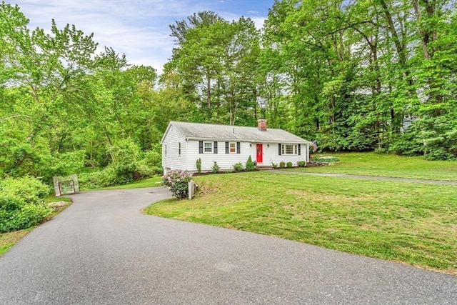 23 Cherokee Rd, Acton, MA 01720 - view of front of house with a chimney and a front yard