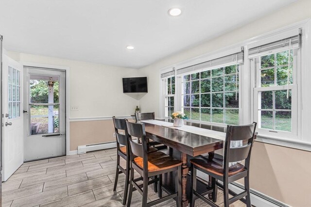 23 Cherokee Rd, Acton, MA 01720 - dining area featuring wood tiled floors, plenty of natural light, baseboards, baseboard heating, and recessed lighting