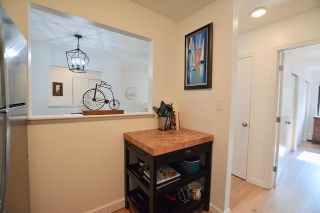 151 Bittersweet Ln Unit 208, Randolph, MA 02368 - hall with light wood finished floors and a chandelier