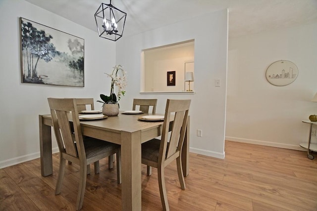 151 Bittersweet Ln Unit 208, Randolph, MA 02368 - dining space with a chandelier and light wood-style flooring
