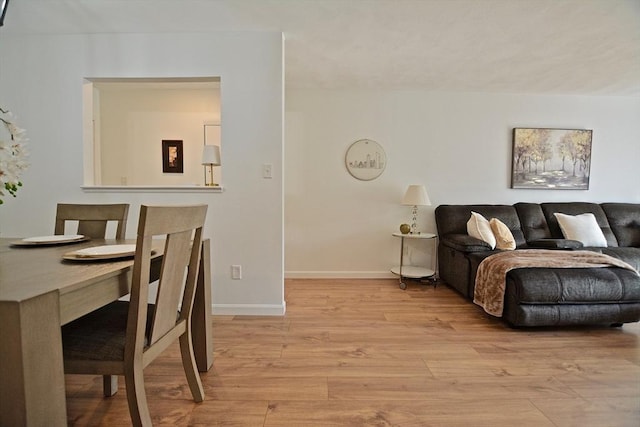 151 Bittersweet Ln Unit 208, Randolph, MA 02368 - living area featuring light wood-style floors and baseboards