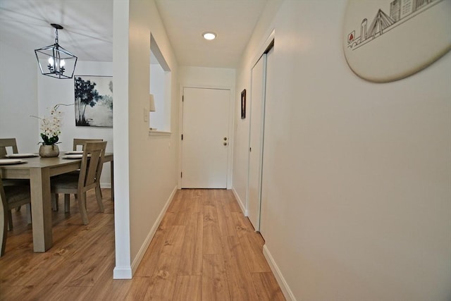 151 Bittersweet Ln Unit 208, Randolph, MA 02368 - hall featuring a chandelier, light wood-type flooring, and recessed lighting
