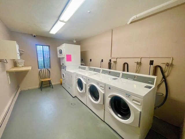 151 Bittersweet Ln Unit 208, Randolph, MA 02368 - shared laundry room featuring separate washer and dryer, baseboard heating, and estacked washer and dryer