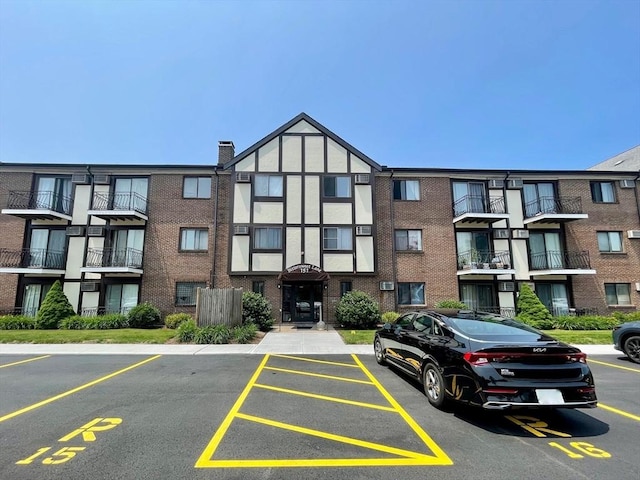 151 Bittersweet Ln Unit 208, Randolph, MA 02368 - view of apartment building / complex with uncovered parking