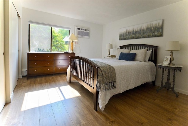 151 Bittersweet Ln Unit 208, Randolph, MA 02368 - bedroom with wood finished floors and a wall mounted AC