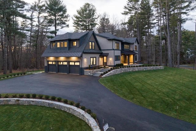 view of front facade featuring a garage and a front yard