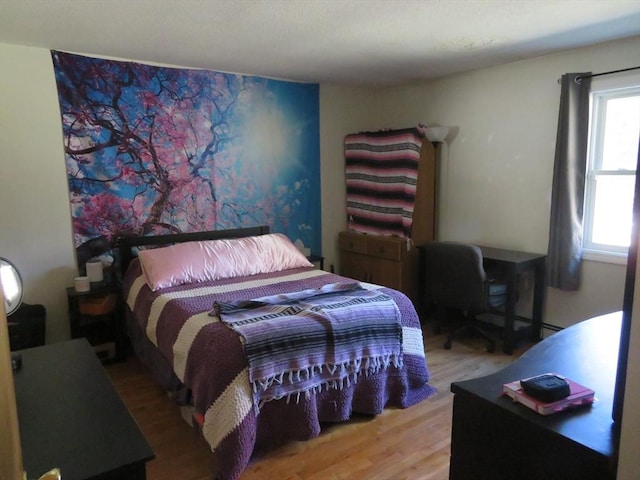 bedroom featuring wood finished floors