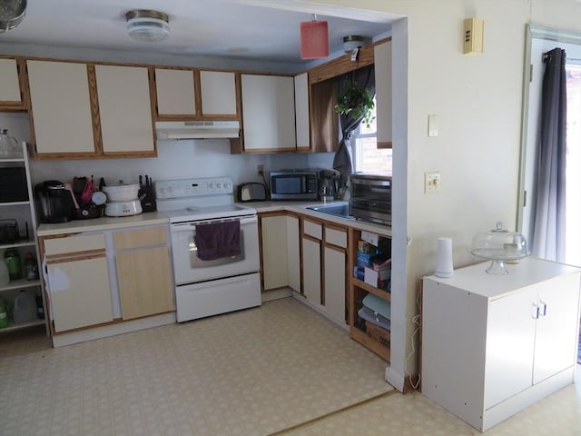 kitchen featuring under cabinet range hood, light countertops, white range with electric stovetop, light floors, and stainless steel microwave