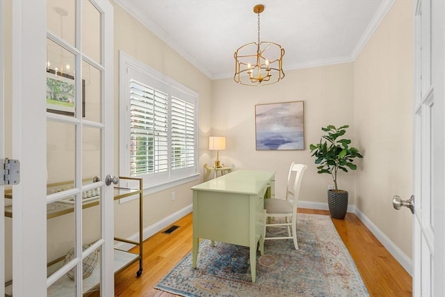 home office with visible vents, a notable chandelier, crown molding, and light wood finished floors