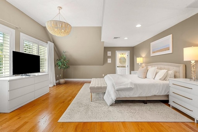 bedroom featuring visible vents, baseboards, recessed lighting, light wood-style floors, and a notable chandelier