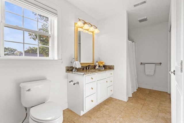 bathroom featuring visible vents, curtained shower, baseboards, toilet, and vanity