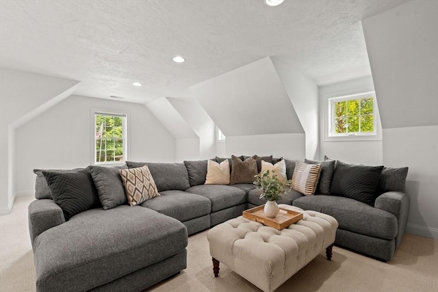 living room featuring baseboards, recessed lighting, vaulted ceiling, a textured ceiling, and carpet flooring