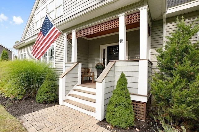 doorway to property with covered porch