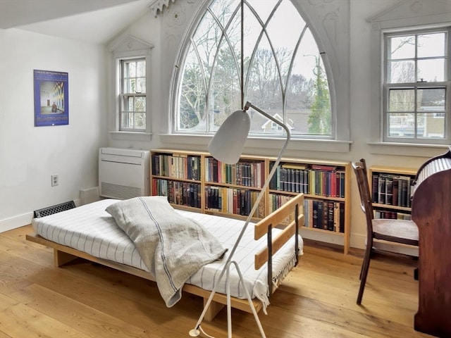 sitting room with lofted ceiling and light hardwood / wood-style floors
