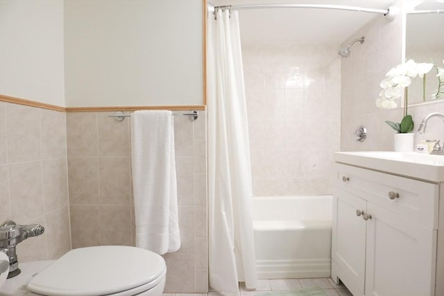 full bathroom with vanity, shower / bathtub combination with curtain, tile walls, and toilet