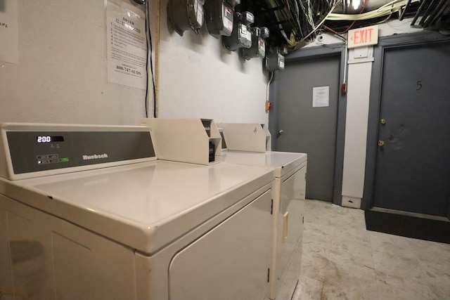 laundry area with separate washer and dryer