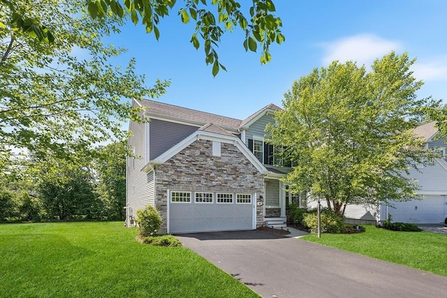 184 Stonehaven Dr, Weymouth, MA 02190 - view of front of property featuring stone siding, driveway, a front yard, and an attached garage