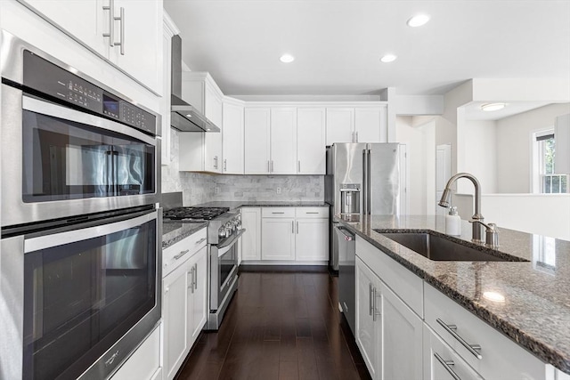 184 Stonehaven Dr, Weymouth, MA 02190 - kitchen featuring stainless steel appliances, a sink, white cabinets, dark stone countertops, and recessed lighting