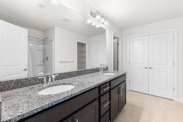 184 Stonehaven Dr, Weymouth, MA 02190 - full bath featuring double vanity, tile patterned floors, a closet, a shower, and baseboards