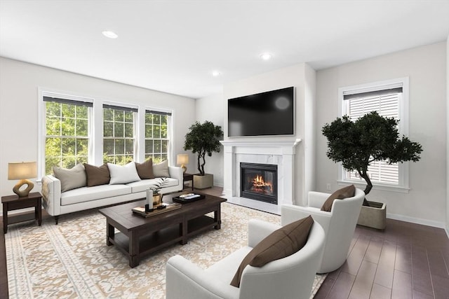 184 Stonehaven Dr, Weymouth, MA 02190 - living area with a premium fireplace, baseboards, recessed lighting, and wood finished floors