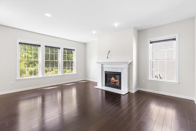 184 Stonehaven Dr, Weymouth, MA 02190 - unfurnished living room featuring a high end fireplace, baseboards, wood finished floors, and recessed lighting