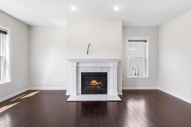184 Stonehaven Dr, Weymouth, MA 02190 - detailed view of a high end fireplace, baseboards, wood finished floors, and recessed lighting